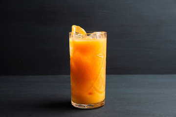 Fresh beverage with mandarines on the rustic background. Selective focus. Shallow depth of field. 