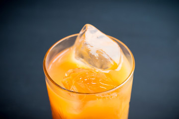 Fresh beverage with mandarines on the rustic background. Selective focus. Shallow depth of field. 