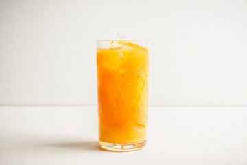Fresh beverage with mandarines on the rustic background. Selective focus. Shallow depth of field. 