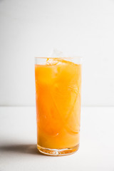Fresh beverage with mandarines on the rustic background. Selective focus. Shallow depth of field. 