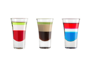 Alcohol shots on a white background. Three colorful shots.