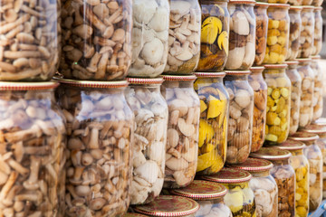 Marinated mushrooms in glass jars