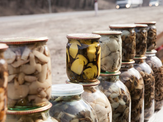 Marinated mushrooms in glass jars