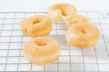 Donut on grille isolated on white background with space for copy.