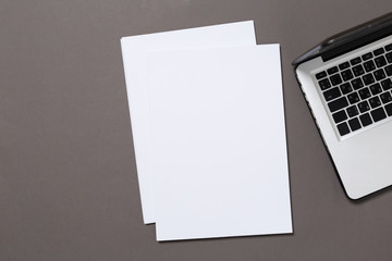office desk top view with blank notebook  isolated on gray, with clipping path, changeable...
