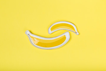 banana-like plate on yellow background