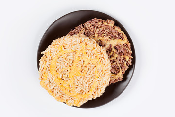 NangLet is a name of rice cake round and flat sweetmeat is a dessert in Thailand, Put on brown plate on white background isolated.