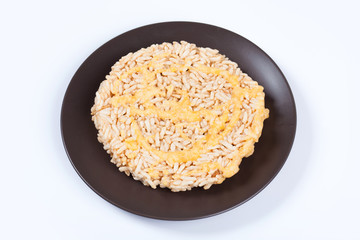 NangLet is a name of rice cake round and flat sweetmeat is a dessert in Thailand, Put on brown plate on white background isolated.