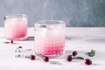 Exotic pink cocktails on light background