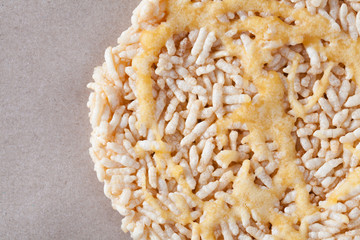 Nang Let is a name of rice cake round and flat sweetmeat is a dessert in Thailand, Put on brown paper background.