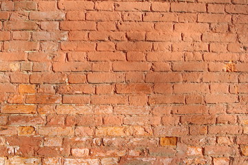 The wall of an old brick building from the 18th century