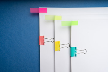 Mock up, stack of papers documents in archives files with paper clips on desk at offices, business concept. Copy space.