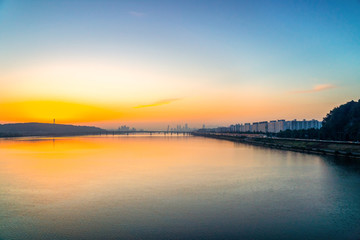 Fototapeta na wymiar Sunrise at Hun River take picture from Airport Railroad Express (AREX) between Seoul to Incheon Airport , Seoul in South Korea.
