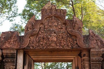 Relief on pediment of North library of Banteay Srei Temple, Cambodia: god Shiva with Parvati atop...