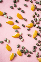 Healthy superfood:  flax seeds, chia seeds and hemp shelled seed on pink background