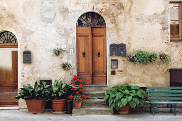 Fototapeta na wymiar facade with flowers in Tuscany Italy