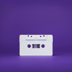 Obraz premium Audio cassette. Vintage white audio cassette tap on colored background. Old cassette tape audio isolated on white.