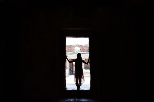 silhouette of woman in doorway