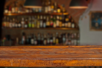 Fototapeta na wymiar Mockup. Blurred bar in the background. A wooden board in the foreground.