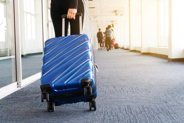 Traveler women and luggage at airport terminal Travel concept