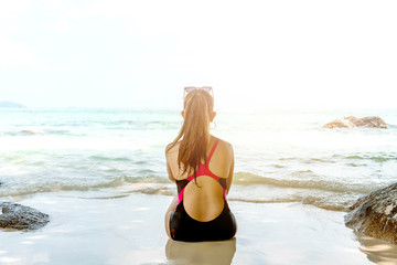 Fototapeta na wymiar Summer Beach Holiday Woman relax on the beach in free time .