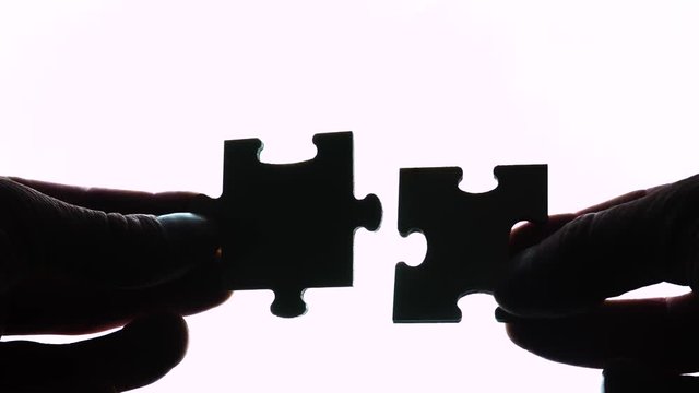 puzzle in hands isolated on white background