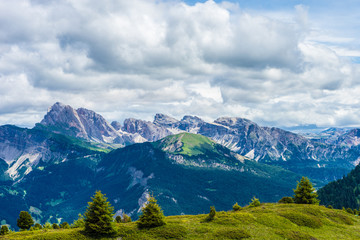 Alpe di Siusi, Seiser Alm with Sassolungo Langkofel Dolomite, a view of a large mountain in the background