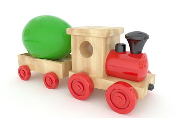 Easter wooden locomotive with wagons carrying Easter eggs