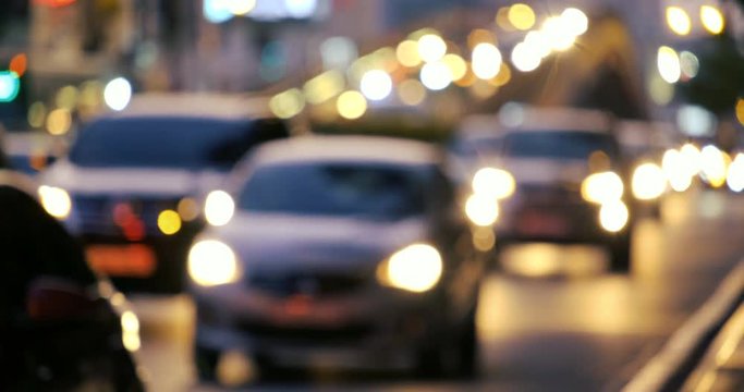 Defocused, blurry, blurred of slow moving traffic with a lots of motorcycles, motorbike, bus, car... transport on the road. Stock footage of urban infrastructure problem, traffic congestion asia