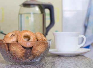 cookies in a vase for Breakfast with tea, kettle in the background