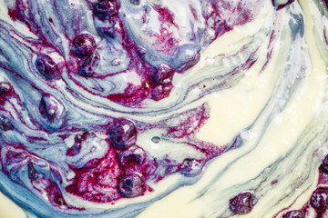 Obraz premium Muffins making. Raw dough mixing with berries. Selective focus.