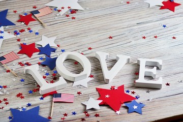 Wooden letters are laid out in the word love, July 4, happy independence day, patriotism, memory of veterans, the concept 