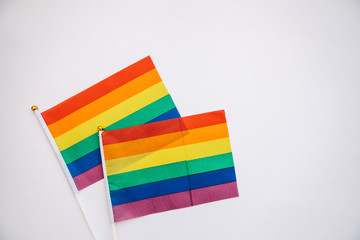 Multicolored flags of the color of the rainbow or LGBT flags on a white background.