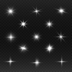 Fototapeta premium A set of bright beautiful stars. Light effect. Bright Star. Beautiful light for illustration. Christmas star.White sparkles shine special light effect. Vector sparkles on a transparent background.
