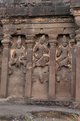 Outer wall of cave 16, facade detail with Karthikeya, Agni and Vayu, Hindu Caves, Ellora, Aurangabad, Maharashtra.