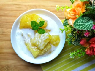 Cassava in syrup topped with coconut milk