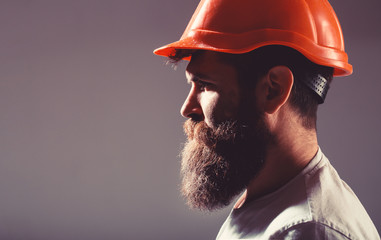 Portrait architect builder, civil engineer working. Builder in hard hat, foreman or repairman in...