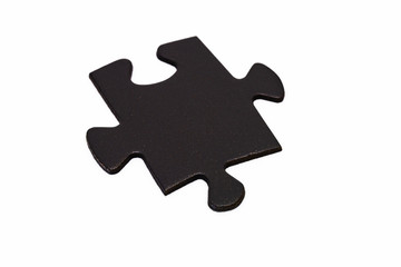 Black puzzle piece on white background