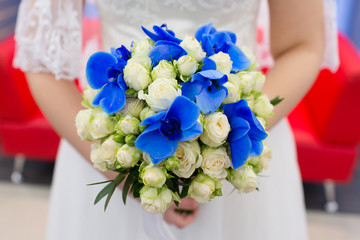 Bride holding her beautuful wedding bouquet, closeup