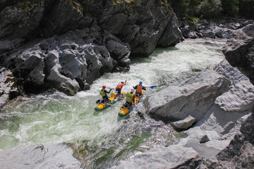  Extreme rafting on the Bashkaus River, extreme sportsmen go through the difficult turbine rapid on a catamaran, Russia, the Altai Republic.  Clean air of Altai and the beauty of Siberia