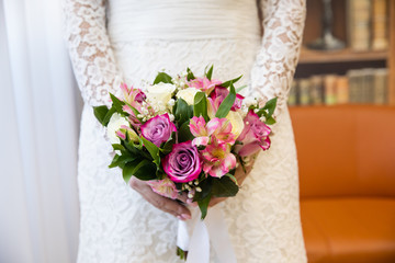 Beautiful wedding bouquet of flowers in bride’s hands