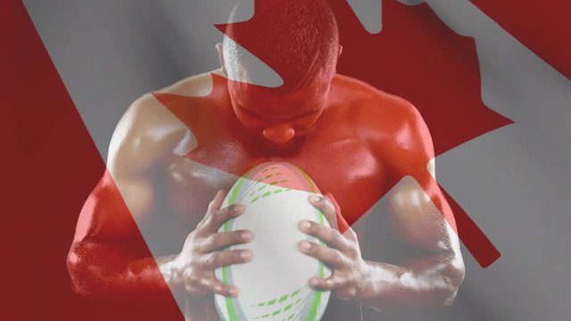 Muscled man holding a ball and shouting with Canadian flag