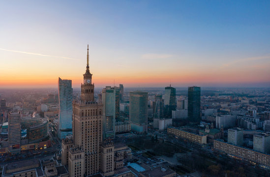 Aerial view of the business center of Warsaw: Palace of Science and Culture and skyscrapers in the evening © vladstar