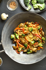Udon stir-fry noodles with vegetables in wok