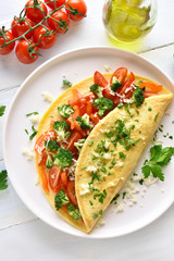 Stuffed omelette with tomatoes, red bell pepper and broccoli