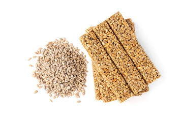 Sunflower kozinaki and seeds isolated on white background.