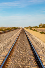 Fototapeta na wymiar Railroad tracks in the Californian desert near the town of Glamis