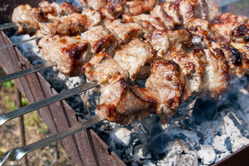 Traditional eastern dish, shish kebab. Roasted meat cooked at barbecue with smoke. .