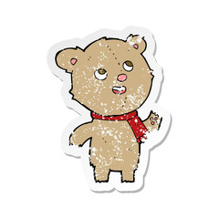 retro distressed sticker of a cartoon teddy bear wearing scarf