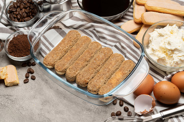 Ingredients for traditional tiramisu cake on concrete background